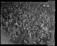 Hundreds crowd the intersection of 7th and Broadway to celebrate New Year’s 1936, Los Angeles, 1935 or 36