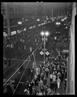 Crowds celebrate New Year's 1936 along Broadway, Los Angeles, 1935 or 1936