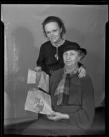 Mrs. M. H. Sevene and Mrs. Will Putnam holding Bills of Sale, Los Angeles, 1936