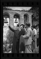 Father Arthur John Hutchinson leads a tour at Mission San Juan Capistrano, San Juan Capistrano, 1936