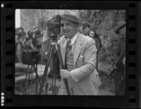 Man with camera at Mission San Juan Capistrano, 1936