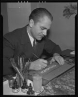 Curtis Elliott works on a jewelry design, Los Angeles, 1936