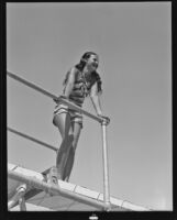 Patricia Allen gazes from a diving board, Palm Springs, 1936