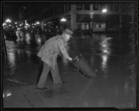 Allen Phelps in a rain storm, Los Angeles, 1936