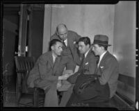 Jack Fields and A. Lewis Newman sit with their attorney, Harry Margid, and investigator Charles Griffin, Los Angeles, 1936