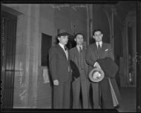 A. Lewis Newman and Jack Fields pose with their attorney, Harry Margid, Los Angeles, 1936