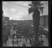 Crowd gathers for a parade outside of the Southern Pacific Railroad Arcade Depot, Los Angeles, 1901 or later