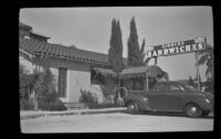 Car parked next to a roadside restaurant, Claremont, 1942