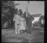 John Clinton Porter, Pearl Randolph Walthers and H. H. West on a front lawn, Covina, 1940