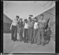 H. H. West Jr., Frank Willis, and fellow Boy Scouts pose in front of tents, Los Angeles, about 1933