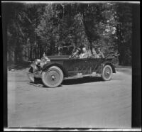 H. H. West, Abraham Whitaker, Agnes Whitaker, H. H. West Jr., and Mertie West sit in a Willys-Knight car, Yosemite National Park, about 1929
