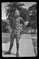 H. H. West Jr. poses wearing his Boy Scouts uniform, Los Angeles, about 1934