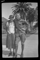 H. H. West Jr. poses with his step-mother, Mertie West, while wearing his Boy Scouts uniform, Los Angeles, about 1934