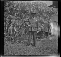 H. H. West stands in the backyard of 2223 Griffin Avenue, Los Angeles, 1942