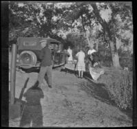 Forrest Whitaker, Abraham Whitaker, Agnes Whitaker, Mertie West at a campsite, Independence vicinity, 1929