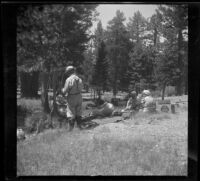 Forrest Whitaker, Mr. Guptill, and others enjoy a picnic by Glass Creek, Crestview, 1942