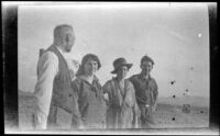 Clarence Cline, Frances Cline, Hattie M. Cline and Giles Major pose in the desert, Nevada, 1923