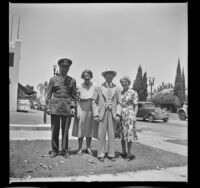 Lynn West, Maud West, Wayne West, and Mertie West pose in the front yard of Wayne West's house, Santa Ana, 1942