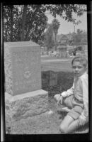 Richard West next to his grandparents, George and Wilhelmina West's gravestone, Los Angeles, 1930