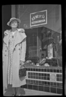 Helen Goforth stands in front of H. H. West's office on Towne Avenue, Los Angeles, 1939
