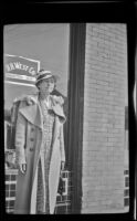 Helen Goforth stands in front of H. H. West's office on Towne Avenue, Los Angeles, 1939