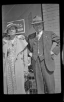 H. H. West and Helen Goforth stand in front of West's office on Town Avenue, Los Angeles, 1939