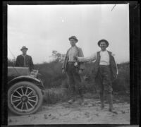 Charles Stavnow, Otto Schmitz and Al Schmitz, hunting rabbits, Palmdale vicinity, circa 1915
