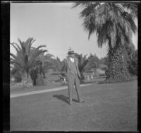 H. H. West stands in Alhambra Park, Alhambra, 1933