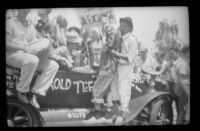 Car filled with participants in a school parade, Alhambra, 1937