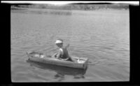 Frances West paddling a rowboat on Lake Arrowhead, circa 1923