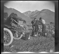 Al Schmitz, Wilfrid Cline and Glen Velzy cook breakfast over a campfire, Ash Creek, 1916