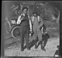 H. H. West poses with his arm around Glen Velzy's shoulders, Sunland-Tujunga vicinity, 1912