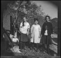 Frances West, Frances Cline and Elizabeth West pose for a photograph next to a car, Sunland-Tujunga vicinity, 1912