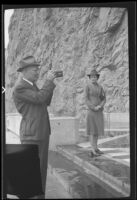 J. O. Hewitt of Dallas, Texas takes a photograph at the Boulder (Hoover) Dam, Boulder City vicinity, 1939