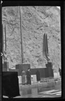 Tablet and flagpole on the Nevada side of the Boulder Dam, viewed from an angle, Boulder City vicinity, 1939