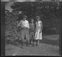 H. H. West, H. H. West, Jr. and Mertie West pose for a photograph at Big Pines Scout Camp, Big Pines vicinity, 1933