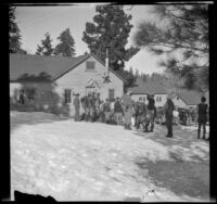 Boys line up at noon and wait for the door to open to the dining room at Big Pines Boy Scout Camp, Big Pines vicinity, 1934