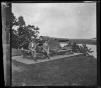 Henry and Fred Lemberger sit by a cannon in Crapo Park, Burlington, 1900