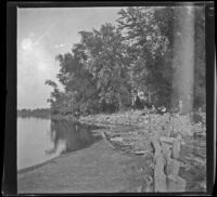 Men on the shore of an island in the Mississippi River, Burlington, 1900