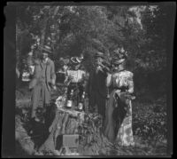 H. H. West's cousins and mother drink on an island in the Mississippi River, Burlington, 1900