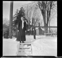 Louise (Lulu) Lemberger stands in the snow by the Lemberger home, Burlington, 1917