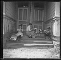 Elizabeth, Mary, and Frances West eat lunch on the steps of a school house, Camarillo, about 1912