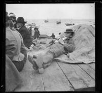 H. H. West takes a nap on a barge, Santa Catalina Island, about 1901