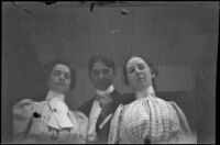 Two women and a man gaze at the camera, Santa Catalina Island, 1903