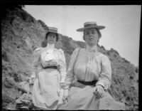 Two women sit on the rocks, Santa Catalina Island, 1903