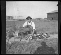 Guy Mansberger butchering ducks, Orange County vicinity, about 1912