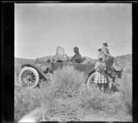 Mary A. West, Frances West, Wilhelmina West and Elizabeth West pose for photograph while the traveling group experiences car trouble, Little Lake vicinity, 1915