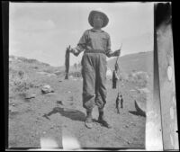 Frances West poses with fish caught in Convict Creek, Mammoth Lakes vicinity, 1914