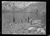 Ted McClellan, his son, Elizabeth West, Frances West, Glen Velzy and H. H. West stand on the shore of Convict Lake, Mammoth Lakes vicinity, 1915