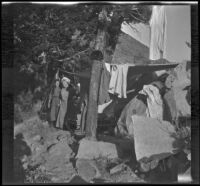 Elizabeth West and Bessie Velzy stand in the Velzy's outdoor sleeping quarters near Convict Creek, Mammoth Lakes vicinity, 1915